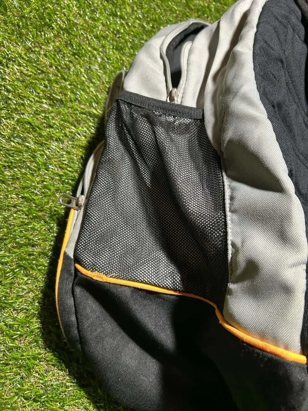 Nike Gray and Black Sport Backpack with Orange Accents